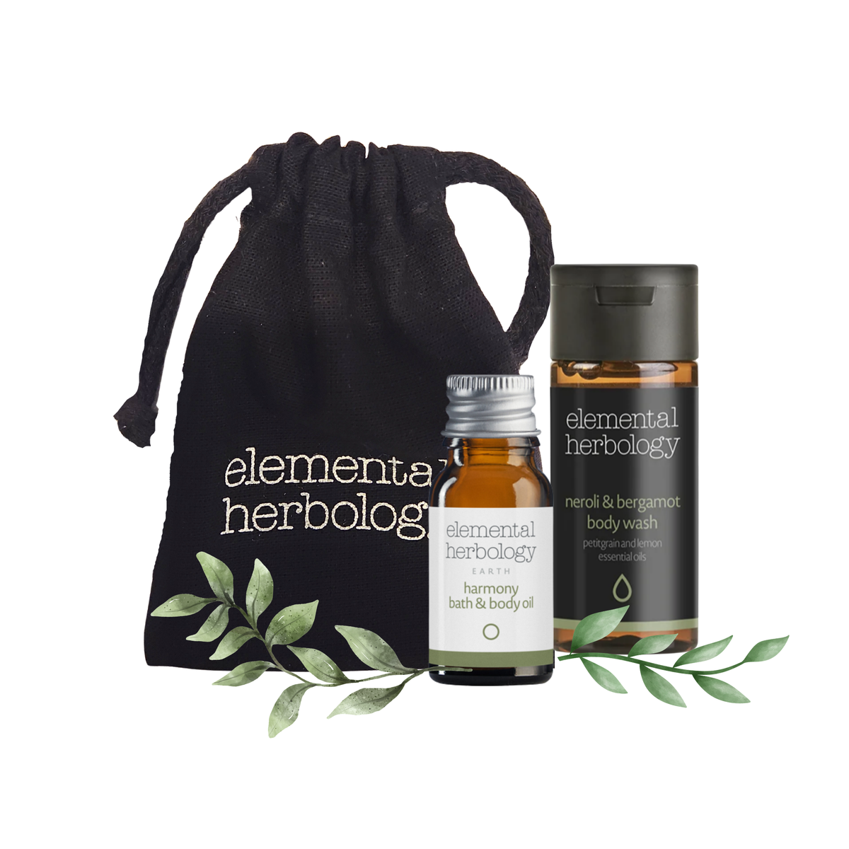 Elementa Herbology bath and body gift set featuring a black drawstring pouch, a small amber glass bath oil bottle, and a larger amber bottle of neroli & bergamot body wash, styled with green leaves on a white background.